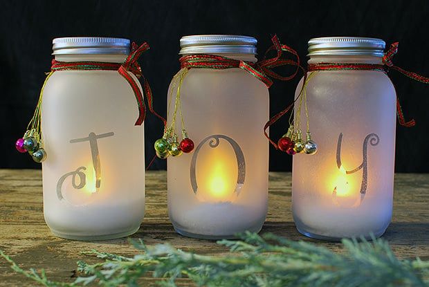 Joy Mason Jar Candle Centerpiece. Christmas Candles in Mason Jars. Mason Jar Candle Ideas for Holidays. Easy Christmas Candle DIY Ideas. How to Make a Holiday Candle with Mason Jars. Mason Jar Crafts for Kids for Christmas. Winter Crafts with Mason Jars. Mason Jar Luminaries for the Holidays. Decorating for the Holidays with Mason Jars.
