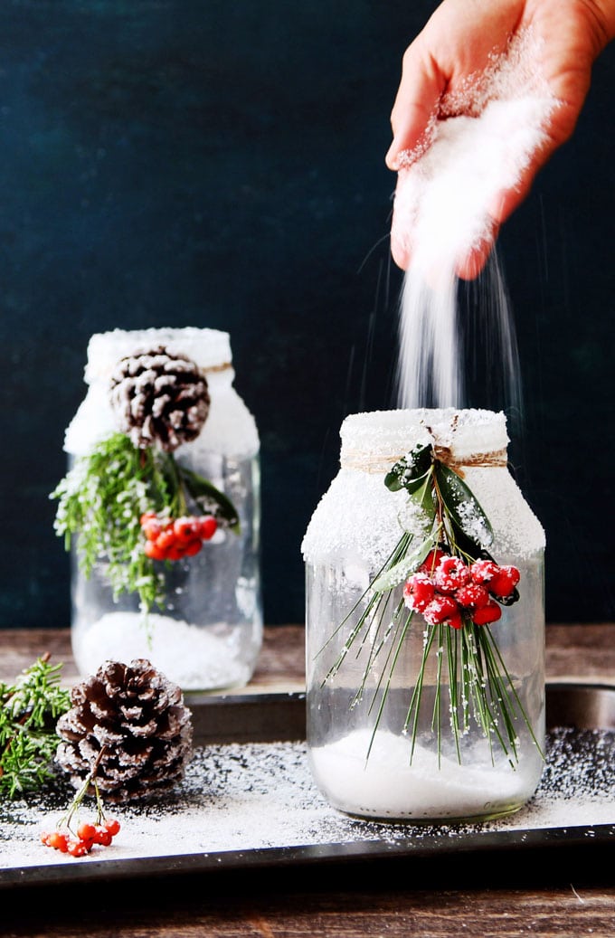 Snowy Christmas Mason Jar Centerpiece Candles with Epsom Salt. Christmas Candles in Mason Jars. Mason Jar Candle Ideas for Holidays. Easy Christmas Candle DIY Ideas. How to Make a Holiday Candle with Mason Jars. Mason Jar Crafts for Kids for Christmas. Winter Crafts with Mason Jars. Mason Jar Luminaries for the Holidays. Decorating for the Holidays with Mason Jars.