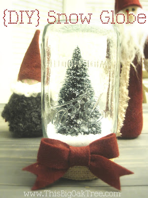 Christmas Tree in Mason Jar with Brown Bow Snow Globe. Mason Jar Snow Globe Craft Ideas. Bottle Brush Trees in Mason Jar Snow Globes. How to Make a Snow Globe in a Jar. Kids Craft Ideas for Christmas with Mason Jars. Gift Ideas in Mason Jars. Winter Crafts Ideas with Snow Globes. Mason Jar Crafts for Christmas. 
