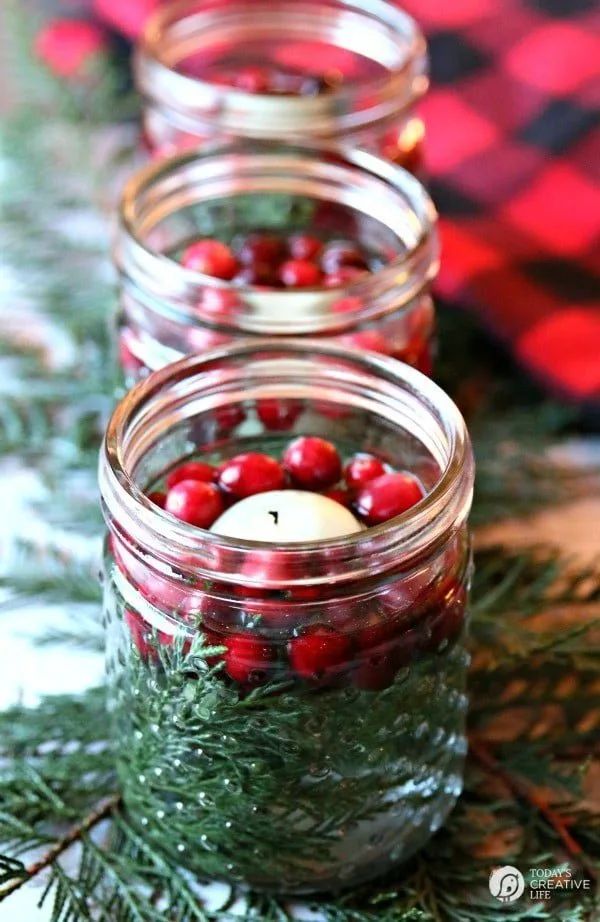 Floating Mason Jar Candles for Christmas. Christmas Candles in Mason Jars. Mason Jar Candle Ideas for Holidays. Easy Christmas Candle DIY Ideas. How to Make a Holiday Candle with Mason Jars. Mason Jar Crafts for Kids for Christmas. Winter Crafts with Mason Jars. Mason Jar Luminaries for the Holidays. Decorating for the Holidays with Mason Jars.