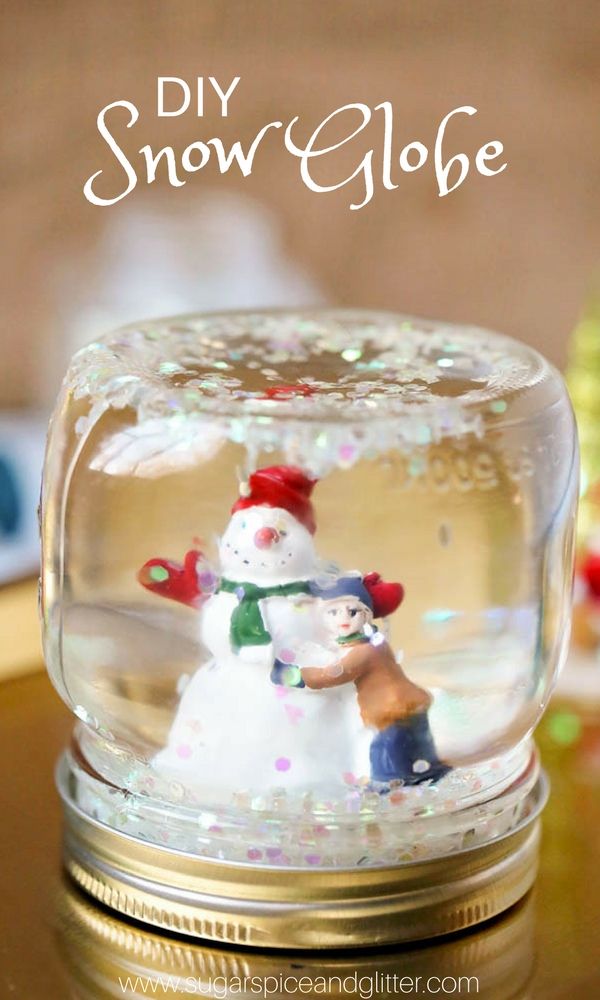Glitter Snow Globe Mason Jar. Mason Jar Snow Globe Craft Ideas. Bottle Brush Trees in Mason Jar Snow Globes. How to Make a Snow Globe in a Jar. Kids Craft Ideas for Christmas with Mason Jars. Gift Ideas in Mason Jars. Winter Crafts Ideas with Snow Globes. Mason Jar Crafts for Christmas. 