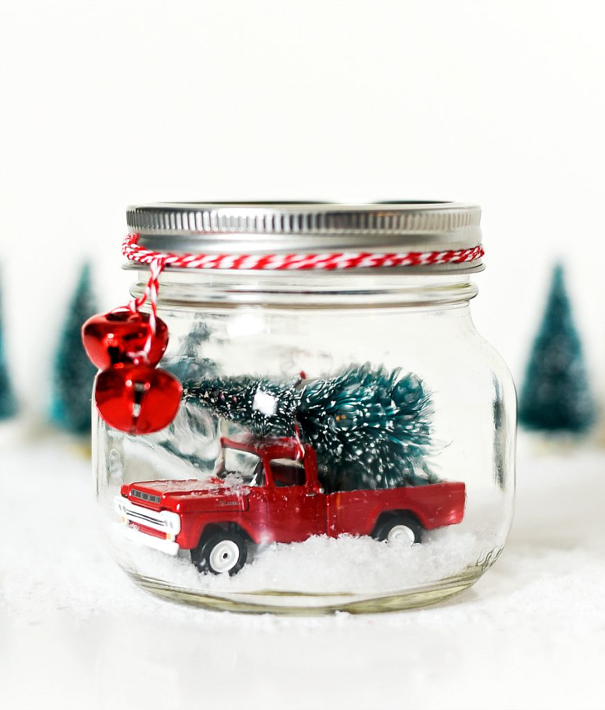 Vintage Truck in Mason Jar with Bottle Brush Tree Snow Globe DIY. Mason Jar Snow Globe Craft Ideas. Bottle Brush Trees in Mason Jar Snow Globes. How to Make a Snow Globe in a Jar. Kids Craft Ideas for Christmas with Mason Jars. Gift Ideas in Mason Jars. Winter Crafts Ideas with Snow Globes. Mason Jar Crafts for Christmas. 