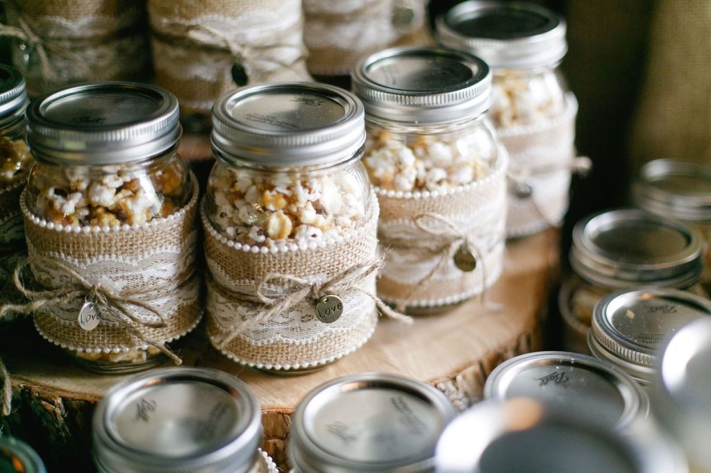 Popcorn in Mason Jars. Popcorn Recipe Ideas for National Popcorn Day. DIY Popcorn in Mason Jar Wedding Favors with Burlap and Twine. Gourmet Popcorn Recipes. Popcorn Mason Jar Gift Ideas. Popcorn Mason Jar Wedding Favor Ideas.