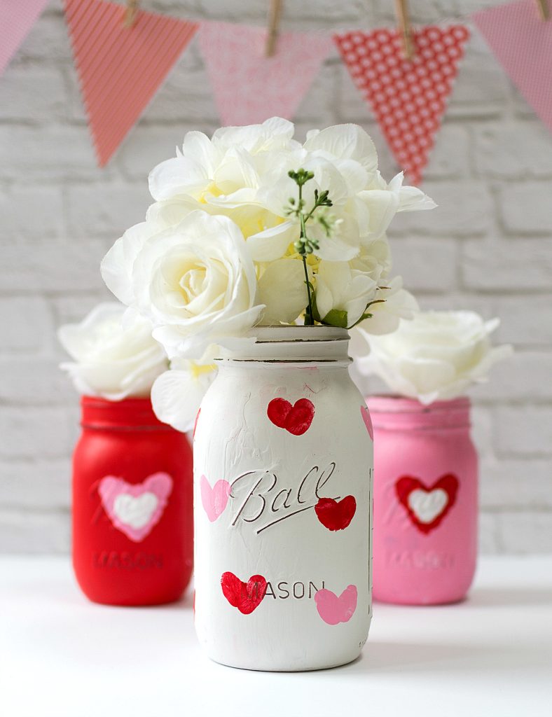Thumbprint Heart Mason Jar Craft for Valentine's Day for kids. Valentine's Mason Jar Crafts for Kids - Kid's Crafts Ideas for Valentine's Day with Mason Jars.