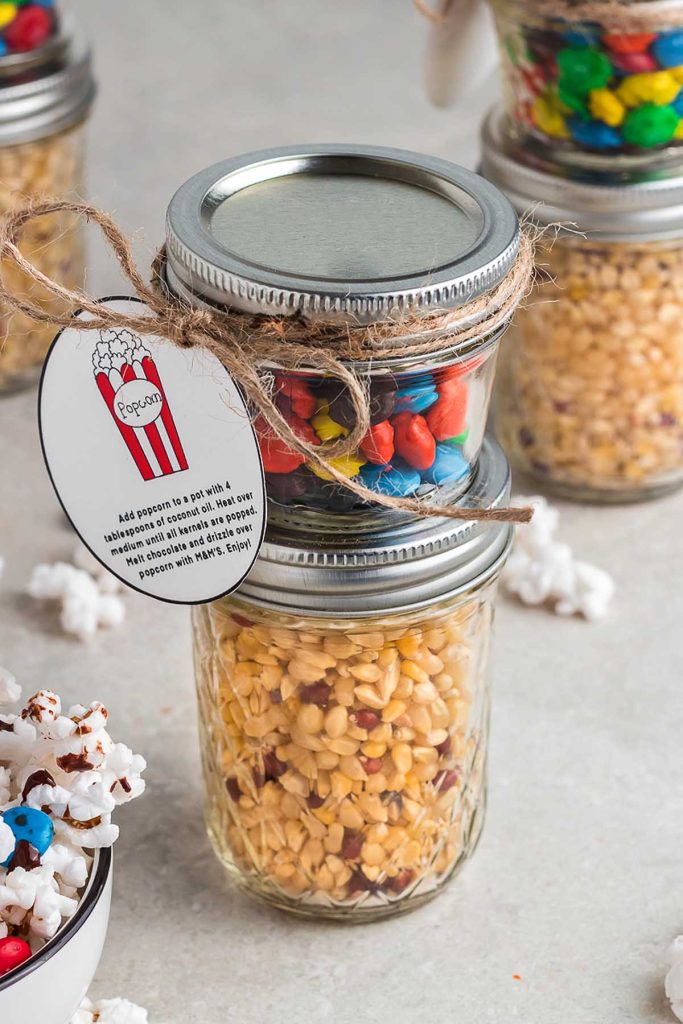 Popcorn in Mason Jars. Popcorn Recipe Ideas for National Popcorn Day. Chocolate M&M Popcorn Recipe. Gourmet Popcorn Recipes. Popcorn Mason Jar Gift Ideas. Popcorn Mason Jar Wedding Favor Ideas.