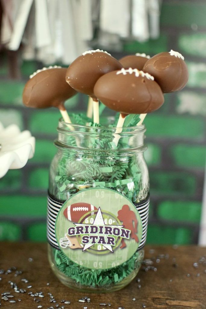 Football Mason Jar Crafts & Party Ideas. Football Party with Mason Jars. Mason Jar Football Centerpiece. Mason jar football drink cups. Mason jar football utensil holder.