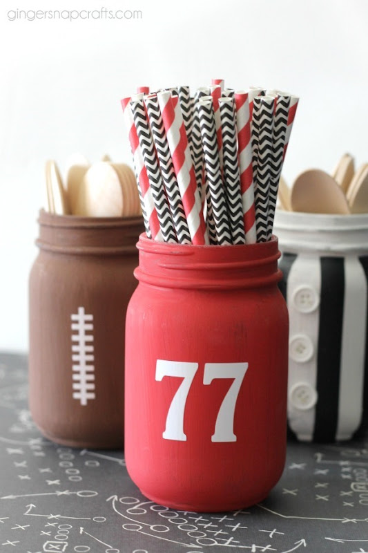 Football Mason Jar Crafts & Party Ideas. Football Party with Mason Jars. Mason Jar Football Centerpiece. Mason jar football drink cups. Mason jar football utensil holder.