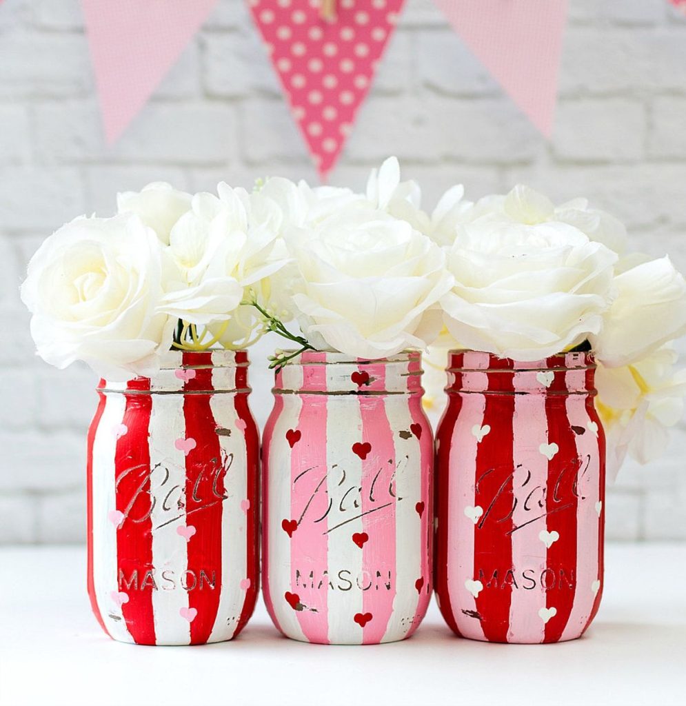 Painted Heart on Mason Jars. Valentine Mason Jar Crafts. Mason Jar Valentine's Day Craft Ideas. Gift Ideas in Mason Jars for Valentine's Day. 55+ Valentine Jar Crafts & More
