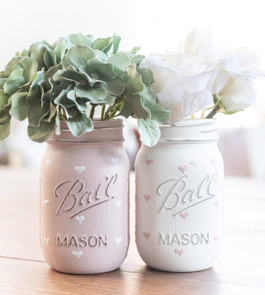 Chalk Painted Hearts on Mason Jars. Valentine Mason Jar Crafts. Mason Jar Valentine's Day Craft Ideas. Gift Ideas in Mason Jars for Valentine's Day. 55+ Valentine Jar Crafts & More