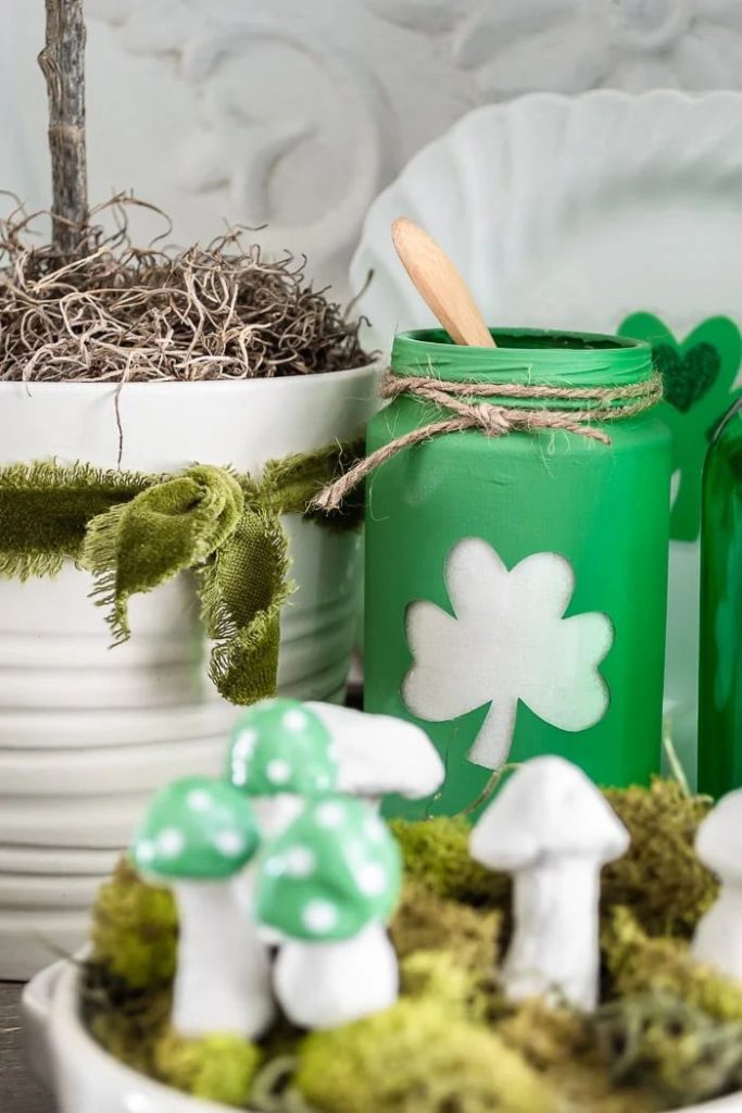 Shamrock Cut Out Painted Mason Jar DIY Craft. Mason Jar Crafts for St. Patrick's Day - Shamrock Crafts for St. Pat's - Pot of Gold Crafts with Mason Jars - Leprechaun Crafts for St. Patrick's Day with Mason Jars - Kids Crafts for St. Patrick's Day