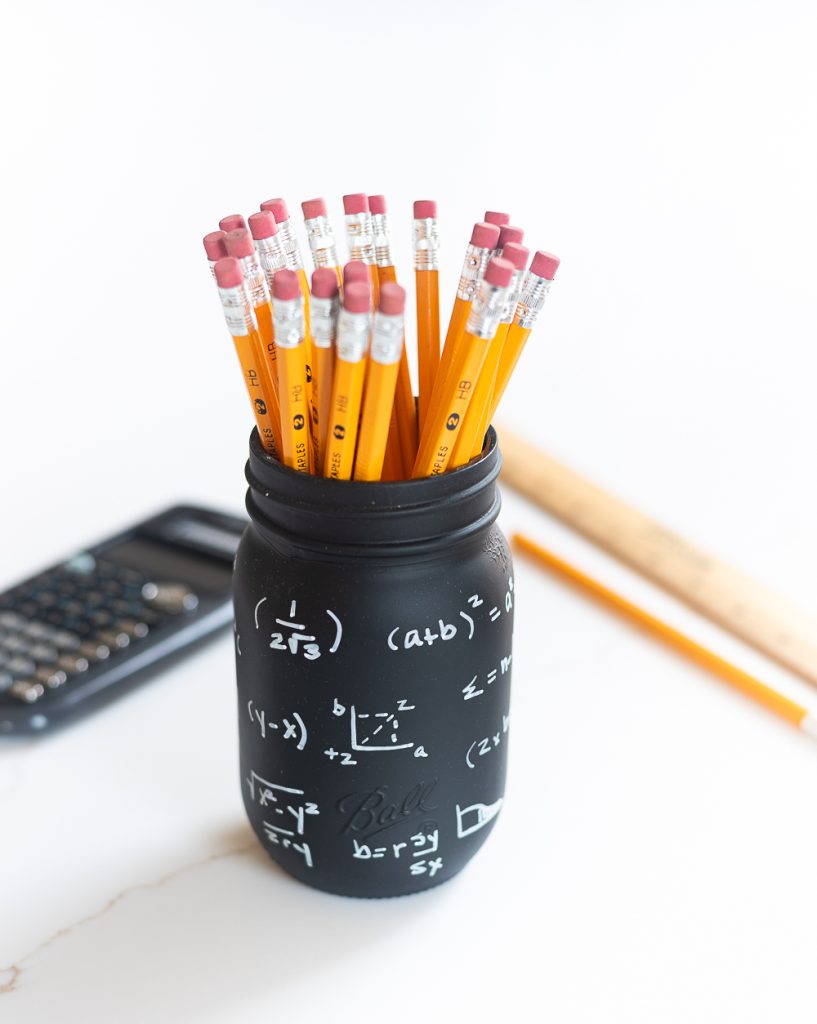 Math Teacher Mason Jar Gift Idea. Teacher Gift Mason Jars - Mason Jar Gift Ideas for Teachers - School Themed Mason Jars. Mason Jar Pencil Holders Themed for School, Students, Teachers. Back to School Teacher Gift Ideas. Holiday Teacher Gift Ideas with Mason Jars. DIY Teacher Gift Ideas.