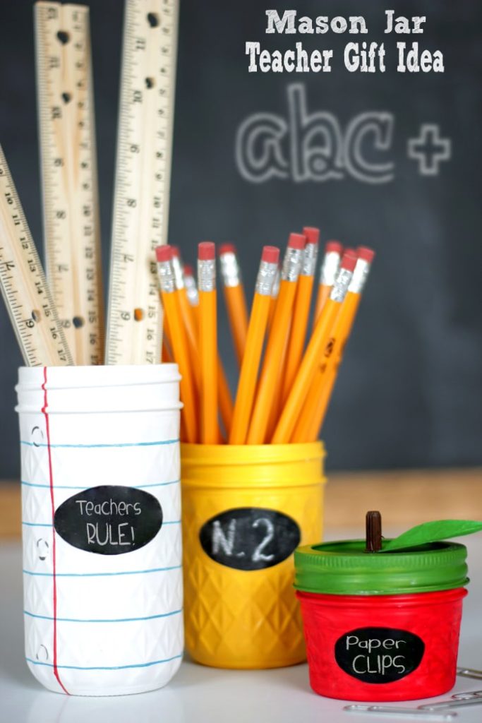 Ruled Paper, No. 2 Pencil and Apple Mason Jar Desk Set. Teacher Gift Mason Jars - Mason Jar Gift Ideas for Teachers - School Themed Mason Jars. Mason Jar Pencil Holders Themed for School, Students, Teachers. Back to School Teacher Gift Ideas. Holiday Teacher Gift Ideas with Mason Jars. DIY Teacher Gift Ideas.