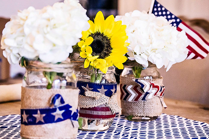 Fourth of July Mason Jar Crafts and Decor Ideas. Red, White and Blue Mason Jars. Patriotic Mason Jars. Semiquincentennial Mason Jars to Celebrate 4th of July. July 4 Decor Ideas with Mason Jars. Mason Jar Kid's Crafts for July 4th.