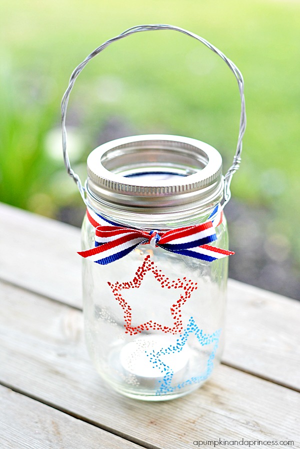 Red White Blue Hanging Mason Jar Votive. Fourth of July Mason Jar Crafts and Decor Ideas. Red, White and Blue Mason Jars. Patriotic Mason Jars. Semiquincentennial Mason Jars to Celebrate 4th of July. July 4 Decor Ideas with Mason Jars. Mason Jar Kid's Crafts for July 4th.
