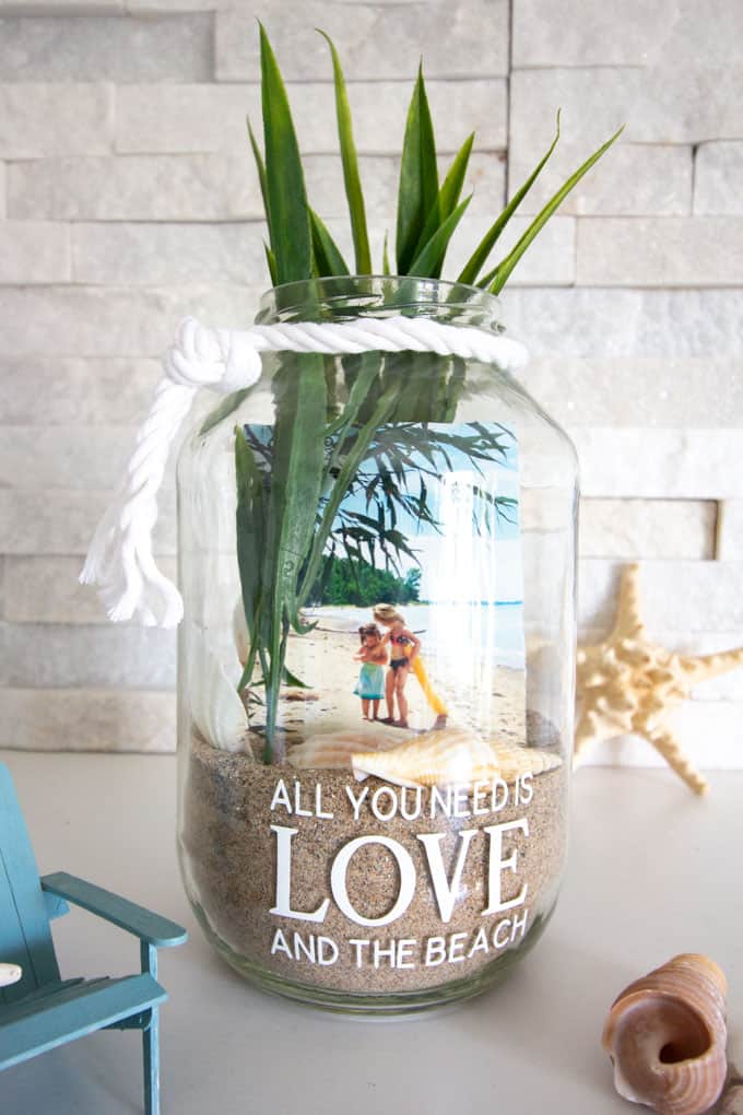 Vacation Mason Jar Photo Display. Summer Mason Jar Crafts. Kid's Craft for Summer with Mason Jars. Coastal Mason Jar Ideas. Painted Mason Jars for Summer. Mason Jar Planters. Twine Wrapped Mason Jar Crafts. Firefly Mason Jars. Mason Jar Votives for Summer.