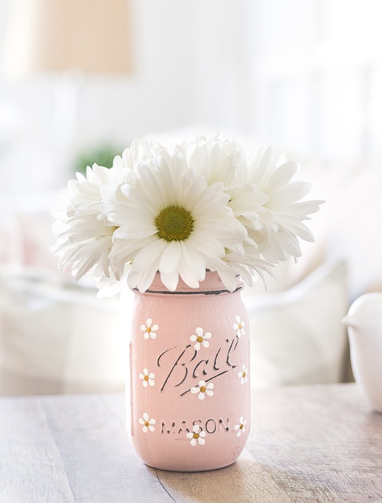 Pint Mason Jar with White and Gold Daisies. Painted Daisies on Mason Jars. Summer Mason Jar Crafts. Kid's Craft for Summer with Mason Jars. Coastal Mason Jar Ideas. Painted Mason Jars for Summer. Mason Jar Planters. Twine Wrapped Mason Jar Crafts. Firefly Mason Jars. Mason Jar Votives for Summer.
