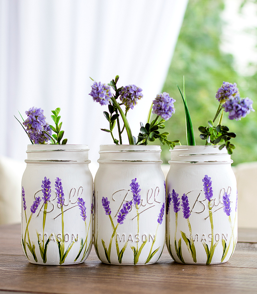 Lavender Flowers Painted on Mason Jars. Summer Mason Jar Crafts. Kid's Craft for Summer with Mason Jars. Coastal Mason Jar Ideas. Painted Mason Jars for Summer. Mason Jar Planters. Twine Wrapped Mason Jar Crafts. Firefly Mason Jars. Mason Jar Votives for Summer.