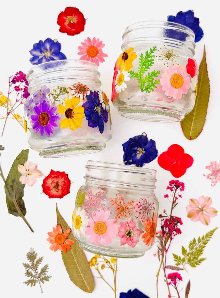 Pressed Flowers on Mason Jars. Decoupage Mason Jars with Dried Flowers. Summer Mason Jar Crafts. Kid's Craft for Summer with Mason Jars. Coastal Mason Jar Ideas. Painted Mason Jars for Summer. Mason Jar Planters. Twine Wrapped Mason Jar Crafts. Firefly Mason Jars. Mason Jar Votives for Summer.