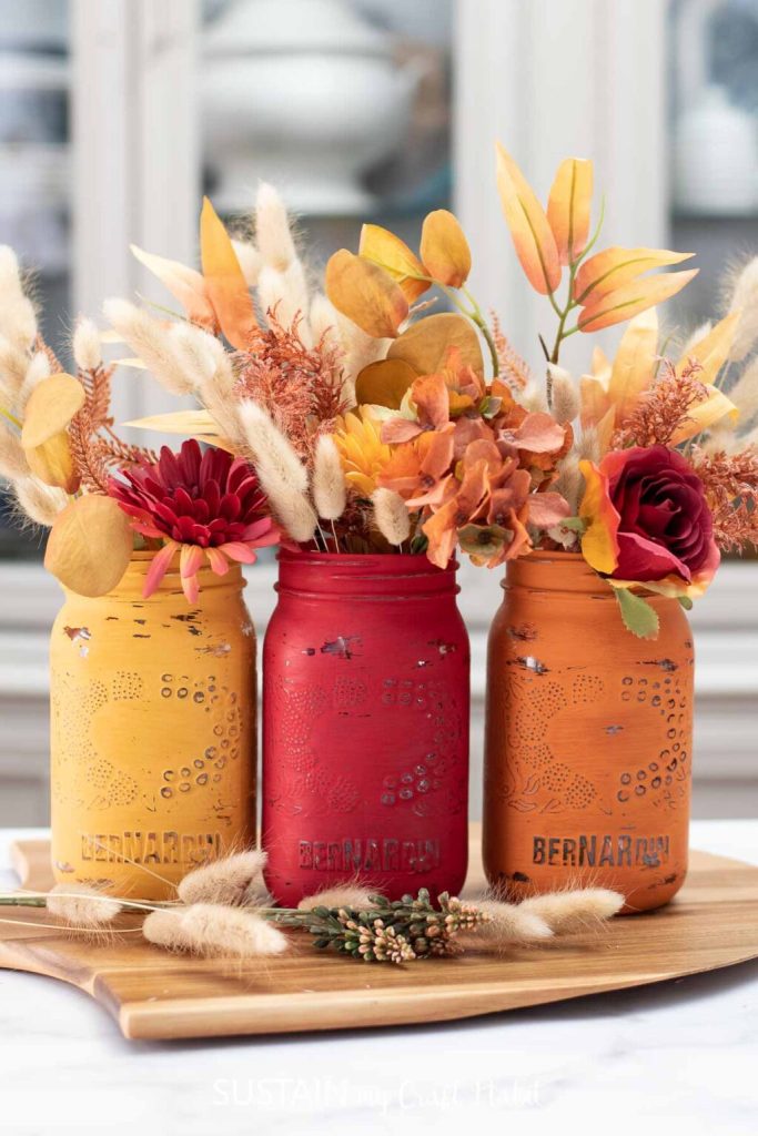Chalk Painted Jars in Fall Colors. Mason Jar Crafts for Fall. 30+ Craft Idea for Autumn. Crafts for Fall with Mason Jars. Mason Jar Autumn Crafts. Painted Mason Jars for Fall. Mason Jar Votives for Fall. Pumpkin Mason Jar Crafts for Fall.