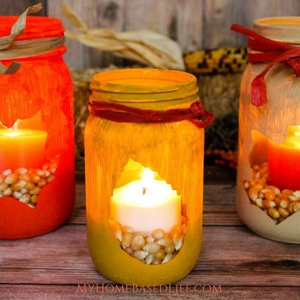 Painted Fall Leaf Cut-Out Mason Jar Luminary. Mason Jar Crafts for Fall. 30+ Craft Idea for Autumn. Crafts for Fall with Mason Jars. Mason Jar Autumn Crafts. Painted Mason Jars for Fall. Mason Jar Votives for Fall. Pumpkin Mason Jar Crafts for Fall.