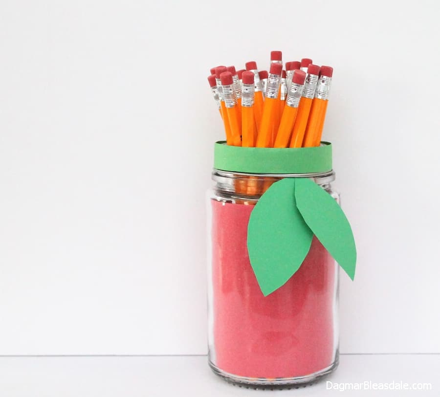 Easy Apple Mason Jar Craft with Construction Paper for Back to School. Mason Jar Craft Ideas for Back to School, Teacher Gift Mason Jars - Mason Jar Gift Ideas for Teachers - School Themed Mason Jars. Mason Jar Pencil Holders Themed for School, Students, Teachers. Back to School Teacher Gift Ideas. Holiday Teacher Gift Ideas with Mason Jars. DIY Teacher Gift Ideas.
