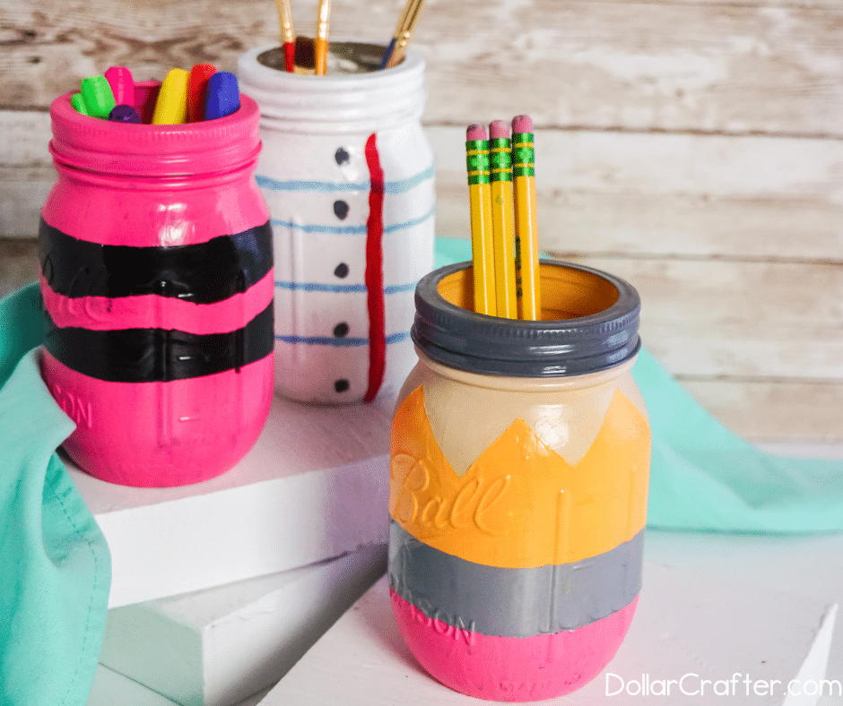 Pencil, Crayon, Ruled Paper Painted Mason Jars for Back to School. Mason Jar Craft Ideas for Back to School, Teacher Gift Mason Jars - Mason Jar Gift Ideas for Teachers - School Themed Mason Jars. Mason Jar Pencil Holders Themed for School, Students, Teachers. Back to School Teacher Gift Ideas. Holiday Teacher Gift Ideas with Mason Jars. DIY Teacher Gift Ideas.